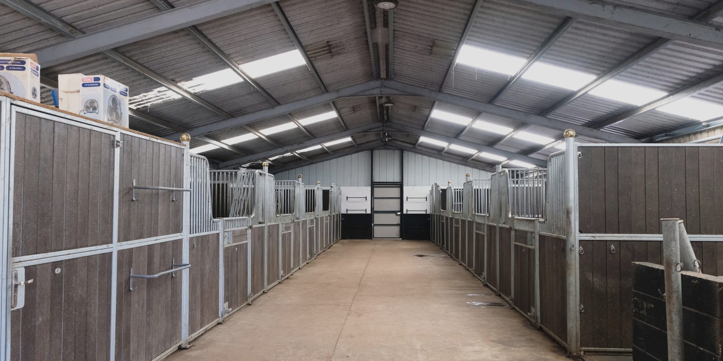 The central aisle of the stable barn, stables either side